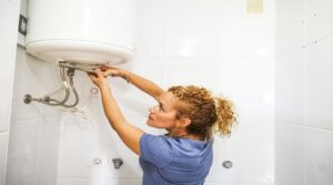 Independence caucasian young woman repair bathroom herself ind